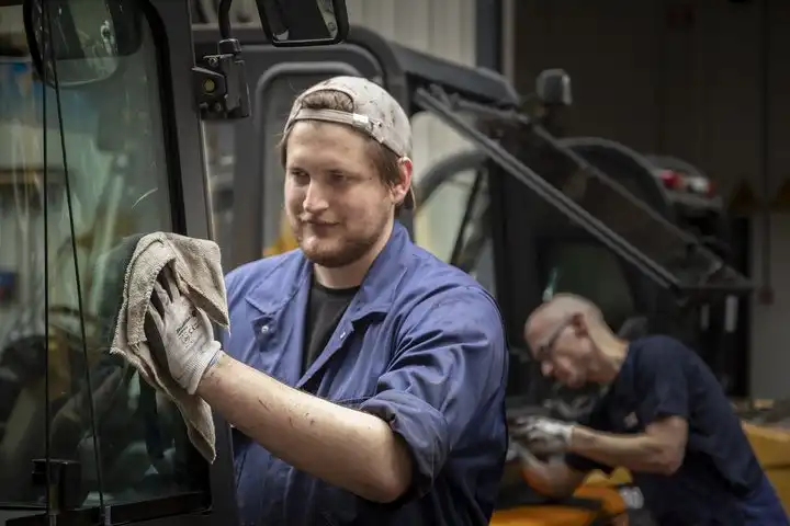 Technicians working on forklift